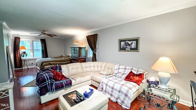 living area featuring ceiling fan, wood finished floors, ornamental molding, and baseboards