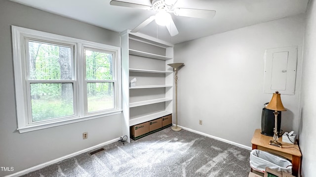 empty room with carpet, baseboards, and ceiling fan