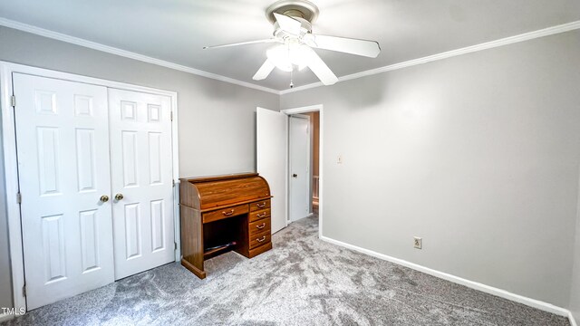 unfurnished bedroom with carpet floors, ornamental molding, a closet, ceiling fan, and baseboards