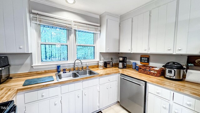 kitchen with dishwasher, a sink, crown molding, and white cabinets