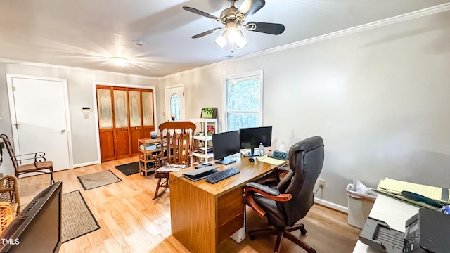 home office with light wood-type flooring, crown molding, ceiling fan, and baseboards