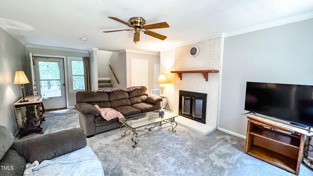 carpeted living area featuring ceiling fan, stairway, ornamental molding, baseboards, and a brick fireplace