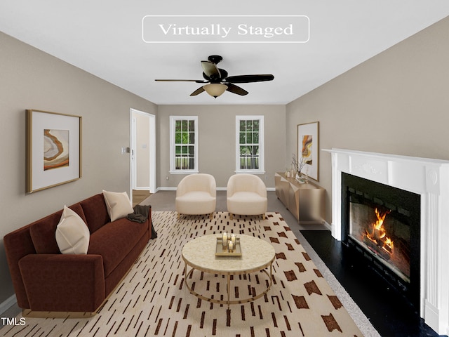 living room featuring hardwood / wood-style flooring and ceiling fan