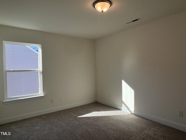 unfurnished room featuring carpet