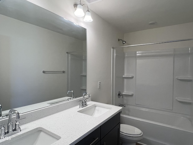 full bathroom featuring vanity, tub / shower combination, and toilet