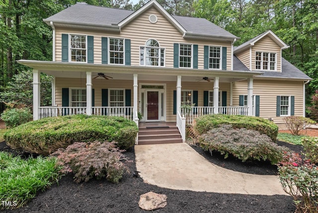 7811 Still Crossing Rd, Chapel Hill, NC 27516 - colonial house featuring a ceiling fan and covered porch