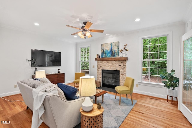 7811 Still Crossing Rd, Chapel Hill, NC 27516 - living room featuring baseboards, crown molding, a fireplace, light wood-style floors, and plenty of natural light