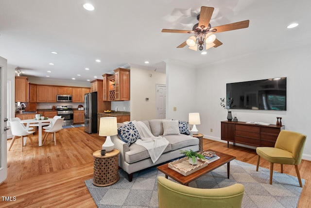 7811 Still Crossing Rd, Chapel Hill, NC 27516 - living area featuring light wood-style flooring, crown molding, recessed lighting, a ceiling fan, and baseboards