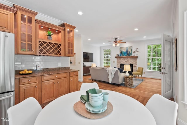 7811 Still Crossing Rd, Chapel Hill, NC 27516 - dining area with healthy amount of natural light, ceiling fan, recessed lighting, wood finished floors, and a bar