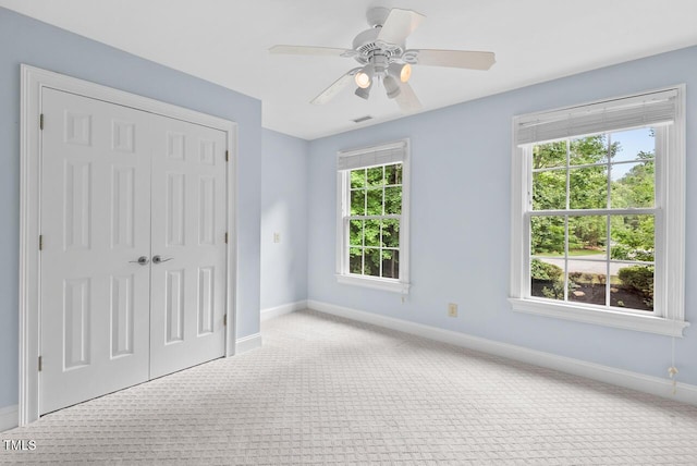 7811 Still Crossing Rd, Chapel Hill, NC 27516 - unfurnished bedroom with carpet floors, baseboards, a closet, and a ceiling fan