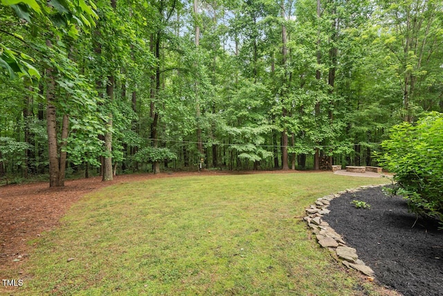 7811 Still Crossing Rd, Chapel Hill, NC 27516 - view of green lawn featuring a forest view