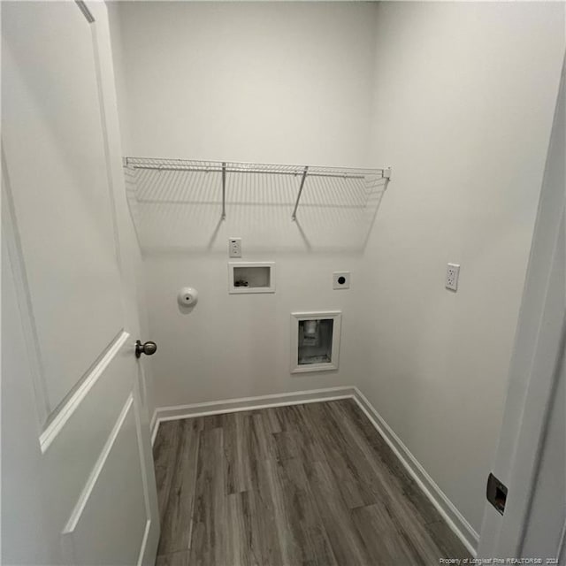 laundry room featuring hookup for an electric dryer, dark wood-type flooring, hookup for a gas dryer, and washer hookup