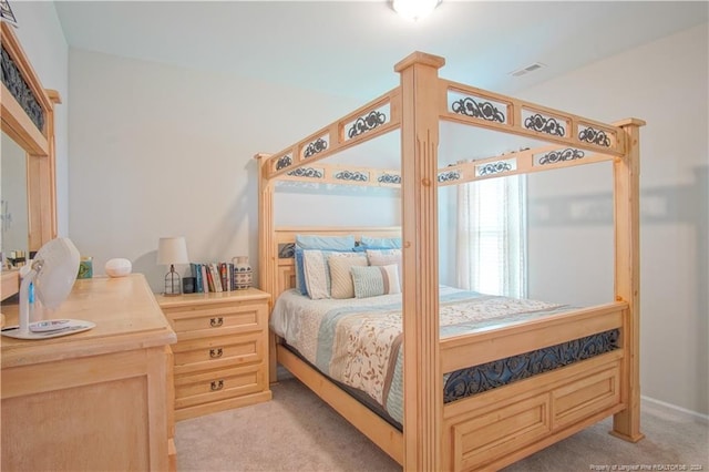 bedroom with light colored carpet