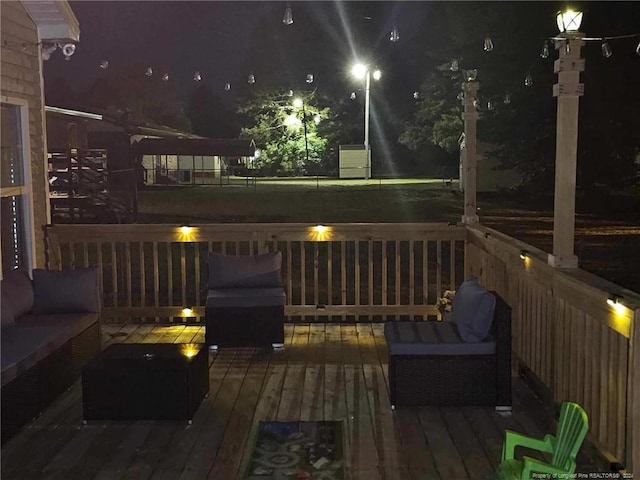 deck at night with outdoor lounge area