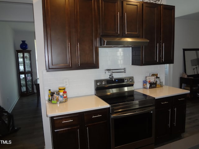 kitchen with decorative backsplash, electric stove, dark hardwood / wood-style flooring, and dark brown cabinets