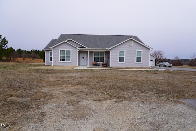 ranch-style home featuring covered porch