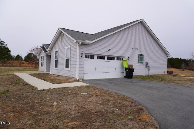 view of home's exterior with a garage