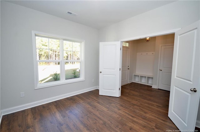 unfurnished bedroom featuring dark hardwood / wood-style floors