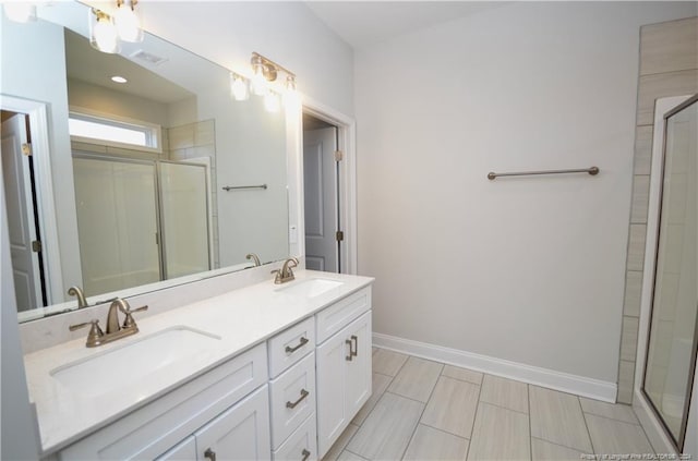 bathroom featuring vanity and an enclosed shower