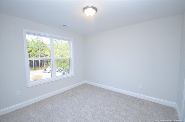 unfurnished room with carpet flooring