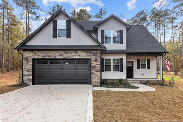 view of front of home with a garage and a front lawn