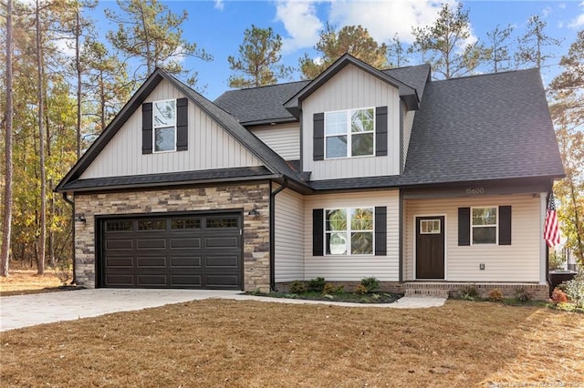 view of front of house featuring a front lawn and a garage