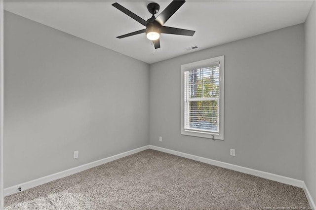 carpeted empty room with ceiling fan