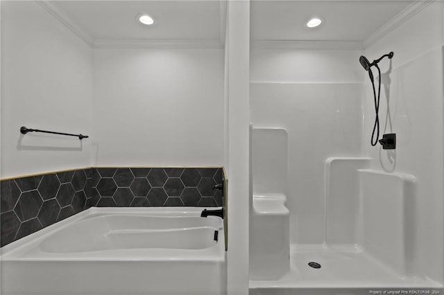 bathroom with a washtub and crown molding