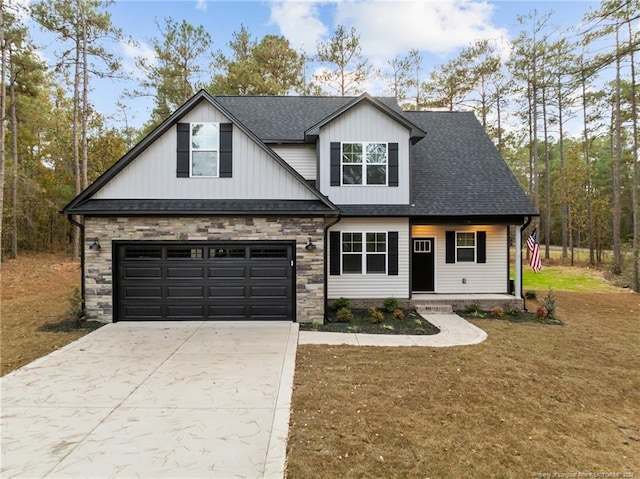 view of front of home with a garage and a front lawn