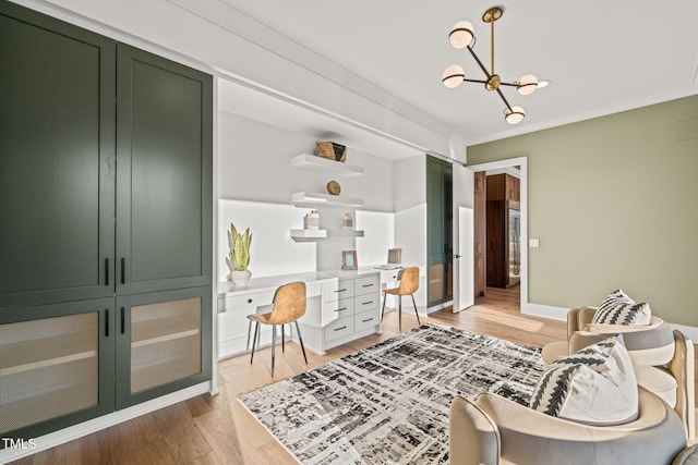 living area featuring ornamental molding, a chandelier, and hardwood / wood-style floors