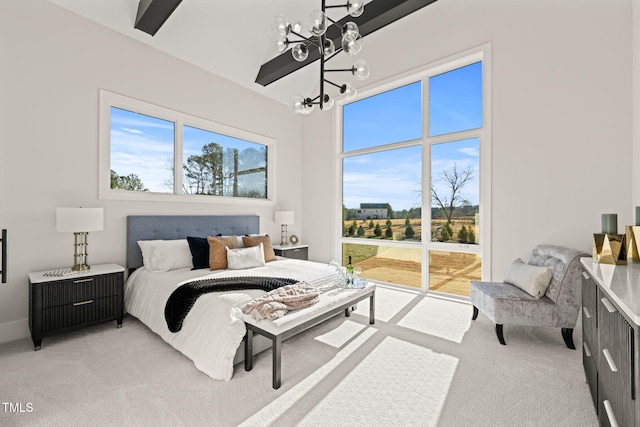 bedroom featuring light colored carpet and a notable chandelier