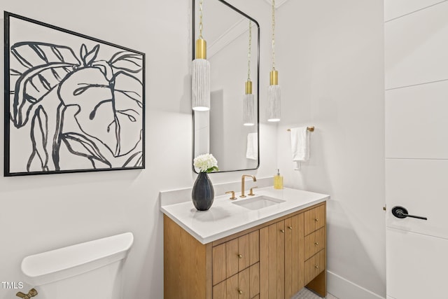 bathroom with vanity and toilet