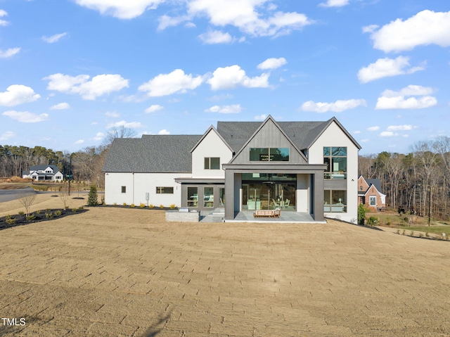 exterior space with a patio and a lawn