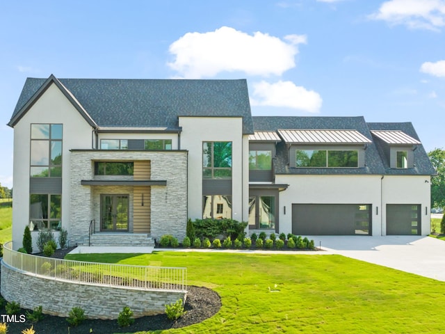 9009 Meadow Pointe Ct, Wake Forest, NC 27587 - contemporary house with stone siding, a standing seam roof, stucco siding, a front yard, and driveway