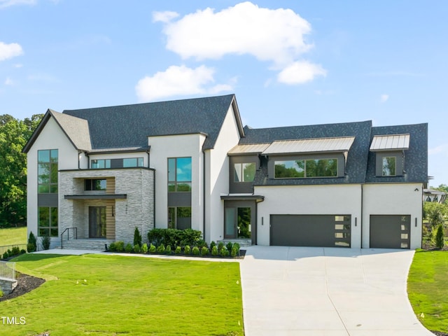 9009 Meadow Pointe Ct, Wake Forest, NC 27587 - contemporary house with stucco siding, an attached garage, driveway, and stone siding