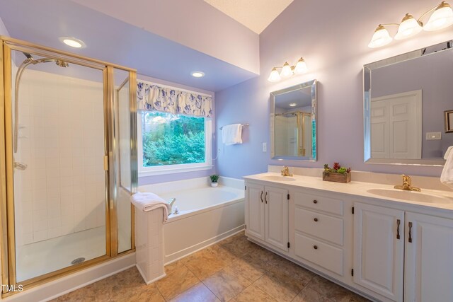 full bath with a stall shower, a bath, double vanity, tile patterned flooring, and recessed lighting
