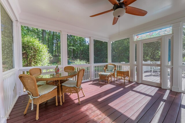 sunroom featuring plenty of natural light and ceiling fan
