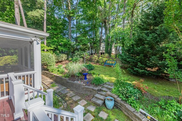view of yard featuring a sunroom