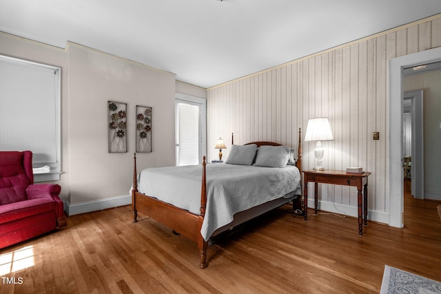 bedroom with wood-type flooring