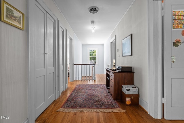 hall with wood-type flooring