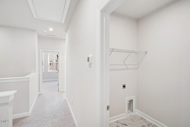 clothes washing area with hookup for an electric dryer and light colored carpet