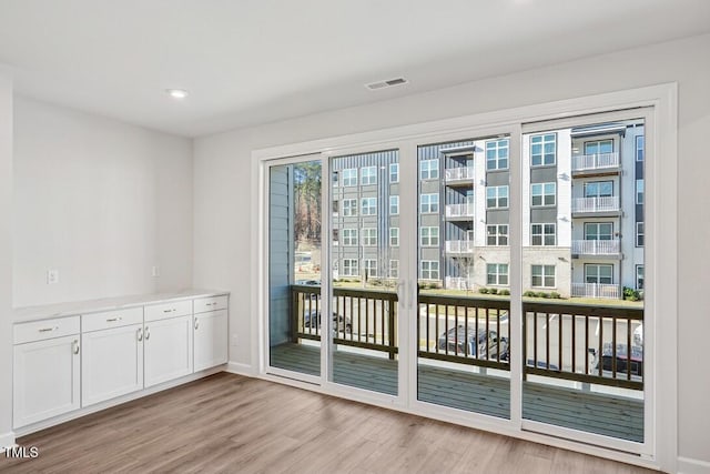 doorway featuring light hardwood / wood-style floors