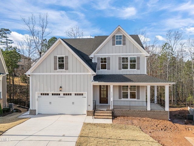 view of front of property with covered porch and a garage