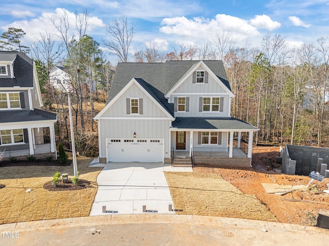 view of front of house with covered porch and a garage