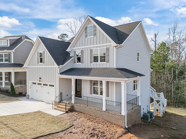 view of front of house with covered porch and a garage