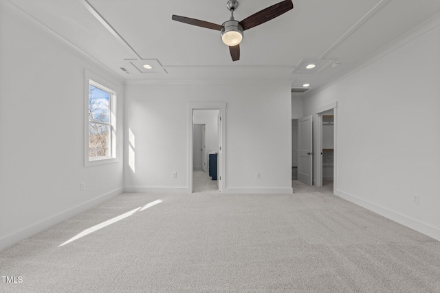 unfurnished bedroom featuring crown molding, light colored carpet, and ceiling fan