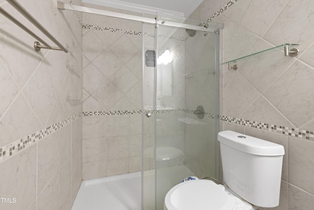 bathroom featuring toilet, tile walls, and walk in shower