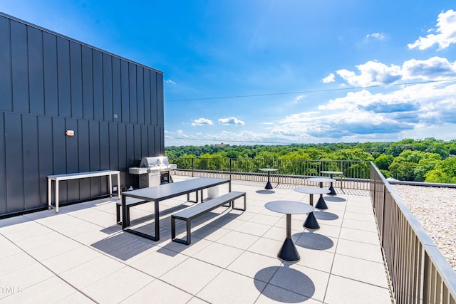 view of patio / terrace with a balcony and grilling area