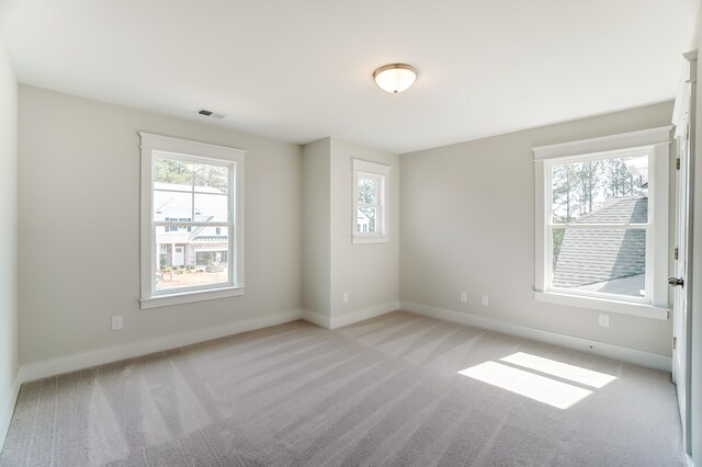 2023 Seneca Dr Lot 32, Raleigh, NC 27604 - carpeted empty room featuring a wealth of natural light
