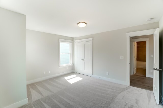 2023 Seneca Dr Lot 32, Raleigh, NC 27604 - unfurnished bedroom with a closet and carpet floors